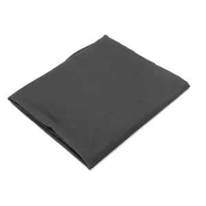 Detail shot of the dark gray hairdressing cape, showcasing its smooth fabric and neat fold.