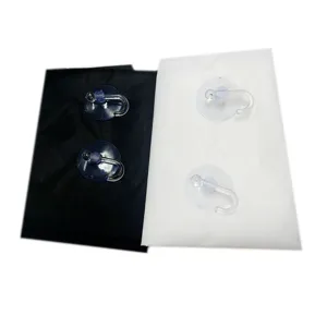 Detail view of professional barber cape apron and suction cups for hair clipping and shaving use.