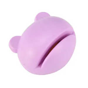 Detail view of the cute purple bear shaped mini kitchen knife sharpener for quick sharpening.