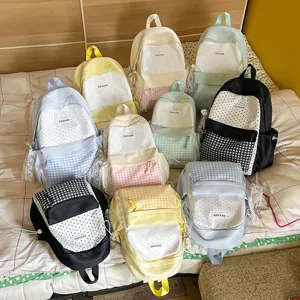 Cute polka dot and plaid backpack for women students, casual large capacity travel bag.