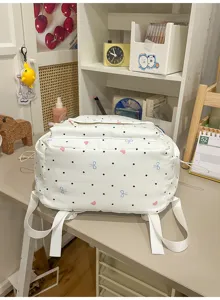 Cute Japanese sweet style white backpack with polka dots and bows for daily school and casual use.