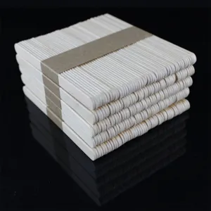 Natural wood craft sticks detail view, smooth surface popsicle sticks for DIY handmade projects.