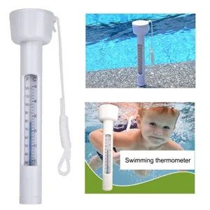 Floating pool thermometer detail view, white plastic body with dual temperature scale.