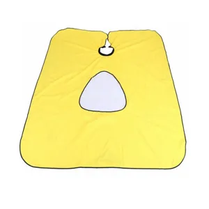 Hairdressing cape with transparent phone window detail, made of durable fabric for salon use.