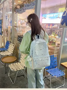 Casual Japanese style star print backpack for women, lightweight school bookbag for daily use.