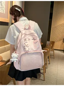 Bonita mochila ita rosa transparente con diseño de estrellas y llavero de peluche para uso diario.