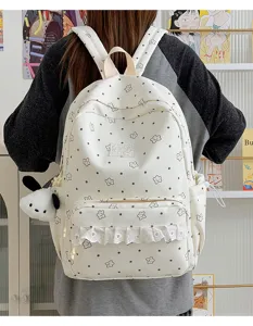 Zaino da scuola in tela stile college con grazioso motivo a stelle e tasca in pizzo.