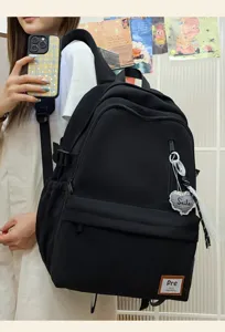 Casual black backpack for school travel, large capacity minimalist design for daily use.
