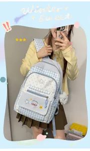 Cute blue plaid school backpack for teen girls sweet preppy style casual daypack with plush charm