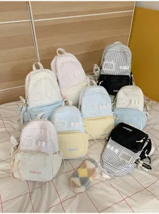 Detailed view of cute striped student backpacks in various pastel colors, perfect for daily use.