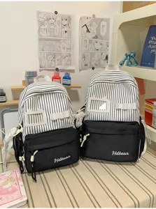 Japanese style cute backpack detail showing black white stripes, front pocket and clear badge slot.