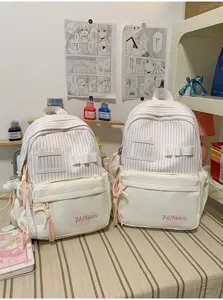 Japanese style sweet pink striped backpack for girls, cute casual school bag with front pocket.