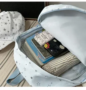 Casual light blue star print school backpack with spacious interior compartments for daily student use.