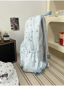 Light blue star print backpack side view showing side pocket and shoulder strap details.