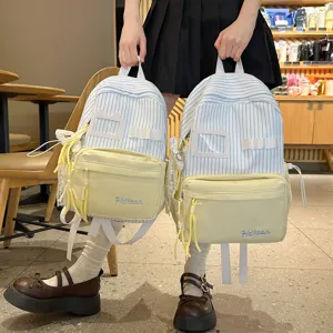 Japanese sweet cute campus style backpack for girls, stylish striped design with front pocket.