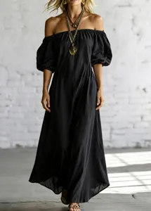 Detail view of a black off-the-shoulder maxi dress with puff sleeves and elegant draped hem.