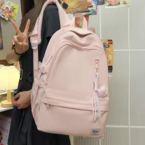 Minimalist large capacity pink backpack for student travel and daily casual use style.