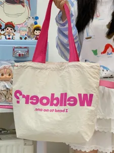 Casual canvas tote bag for women, large capacity shoulder bag with pink strap and drawstring top.