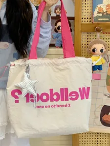Casual canvas tote bag with pink straps, large capacity shoulder bag for women daily commute.