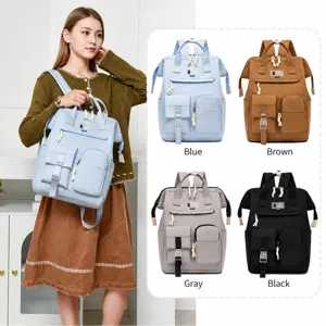 Casual multi-pocket canvas mommy backpack with large capacity, perfect for daily commuting and travel.