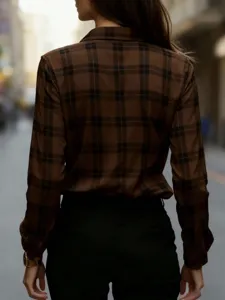 Detail view of the brown plaid long sleeve shirt, showing lapel and slim fit texture.