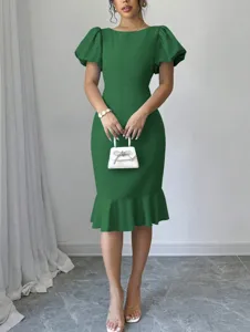 Detailed view of the green puff sleeve midi dress, showing elegant fishtail hem and slim fit.