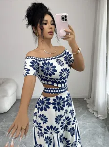 Blue and white floral off-shoulder crop top and cutout skirt set for summer resort.