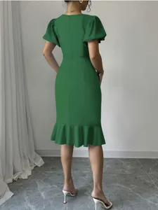Elegant green midi dress featuring puff sleeves and a chic fishtail hem for women.