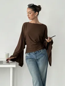 Brown long sleeve top detail shot, elegant batwing sleeve design for casual commuting outfit.