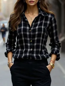 Close-up detail of the stylish black and white plaid long sleeve shirt with a smart lapel.
