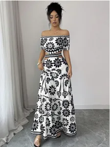 Black and white floral off-the-shoulder crop top with high waist cutout maxi dress.