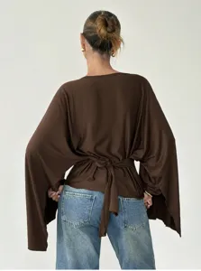 Brown long sleeve blouse with tie waist and flared sleeves, casual chic women apparel top.