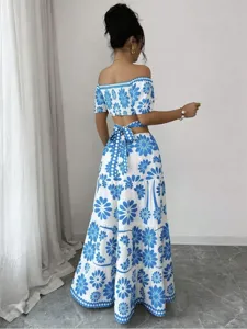 Detailed view of the blue and white floral crop top and tiered maxi skirt with back tie.