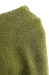 Olive green fabric detail texture close up shot for comfortable apparel item design.