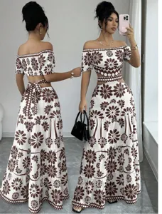 Off-shoulder two-piece floral maxi dress with cutout waist and tie detail for vacation.