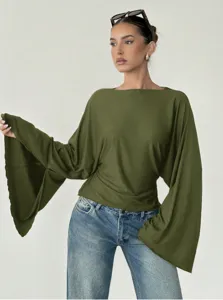 Detailed view of the olive green boat neck top featuring stylish dramatic bell sleeves.