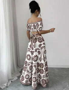 Off-shoulder crop top and tiered maxi skirt two-piece set, brown floral resort vacation outfit.