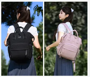 Detailed view of large capacity multi-functional mommy diaper backpack in black and pink.