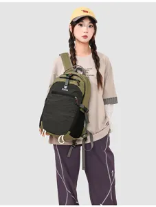 Detail view of the contrast color outdoor backpack with front zipper pocket and adjustable straps.