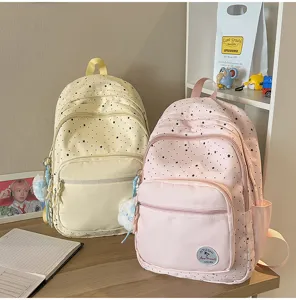 Cute star pattern school backpack for students, sweet casual daypack with front pockets.