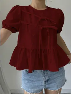 Wine red short sleeve bow tie peplum blouse paired with casual denim shorts detail.