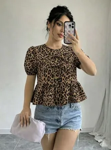 Leopard print short sleeve peplum top with cute front bows and stylish puff sleeves.