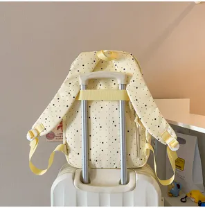 Details view of the cute yellow star print casual backpack, perfect for daily school use.
