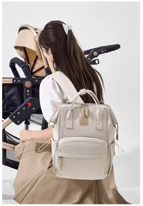 Large capacity mummy backpack, stylish waterproof travel diaper bag with multiple storage pockets.