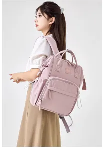 Stylish large capacity pink mommy diaper backpack for mothers, waterproof multi-pocket travel bag.