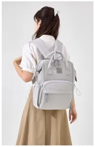 Stylish light gray mommy diaper backpack with multi pockets for spacious daily storage.
