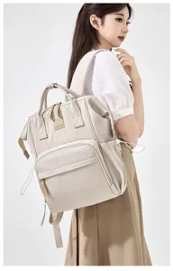 Stylish beige mummy diaper backpack with large capacity, multi-pocket design, daily use.