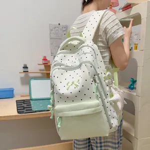 Zaino carino a pois verde menta per ragazze, borsa scolastica casual di grande capacità.