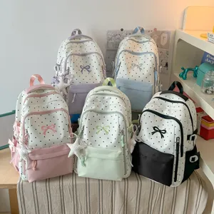 Zaino carino a pois con fiocco da donna, borsa scolastica casual coreana di grande capacità.
