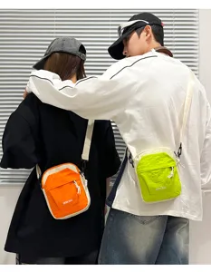 Lightweight contrast color crossbody phone bag for men and women outdoor travel.